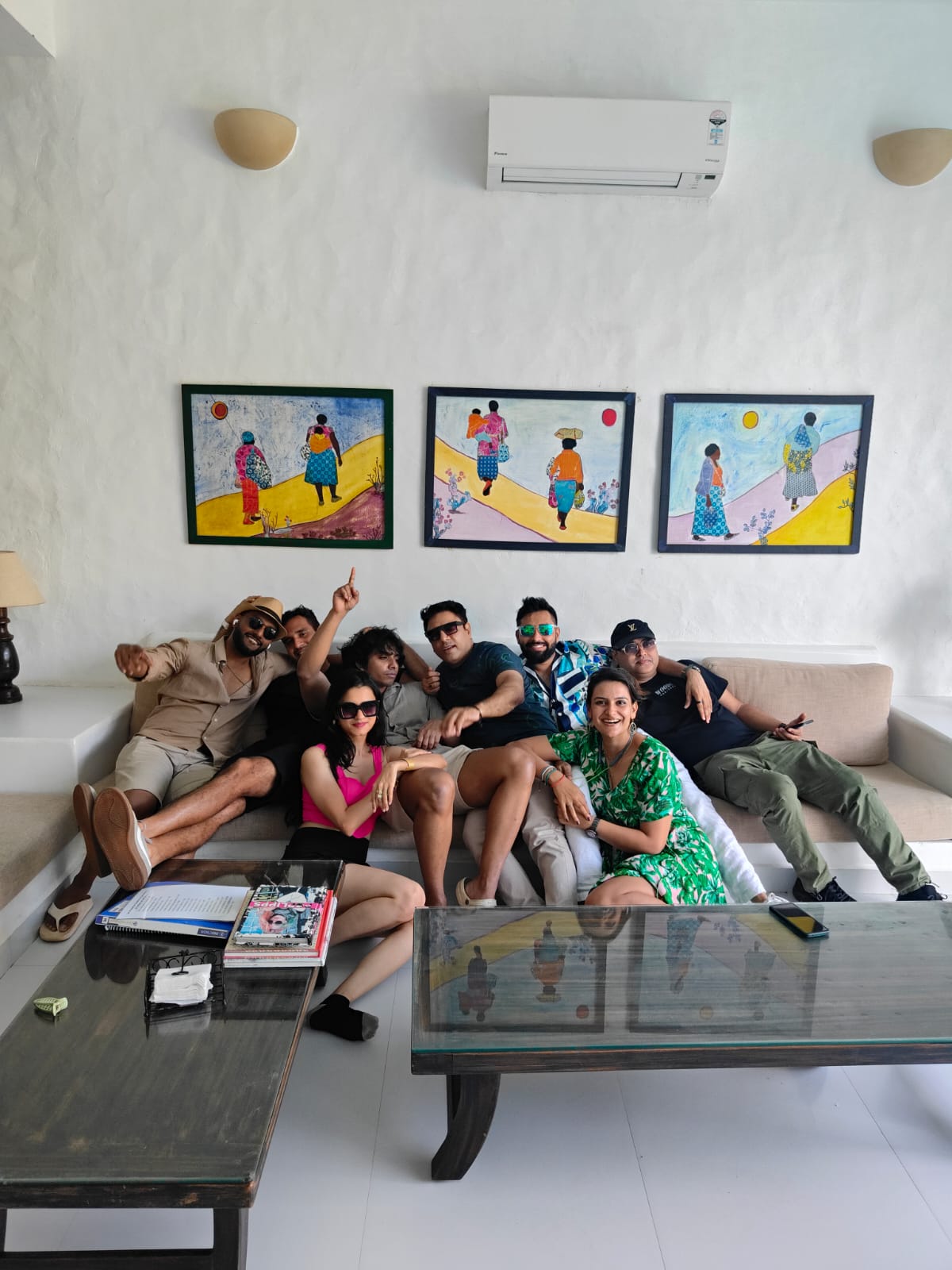 The batch hanging out together in a villa living room