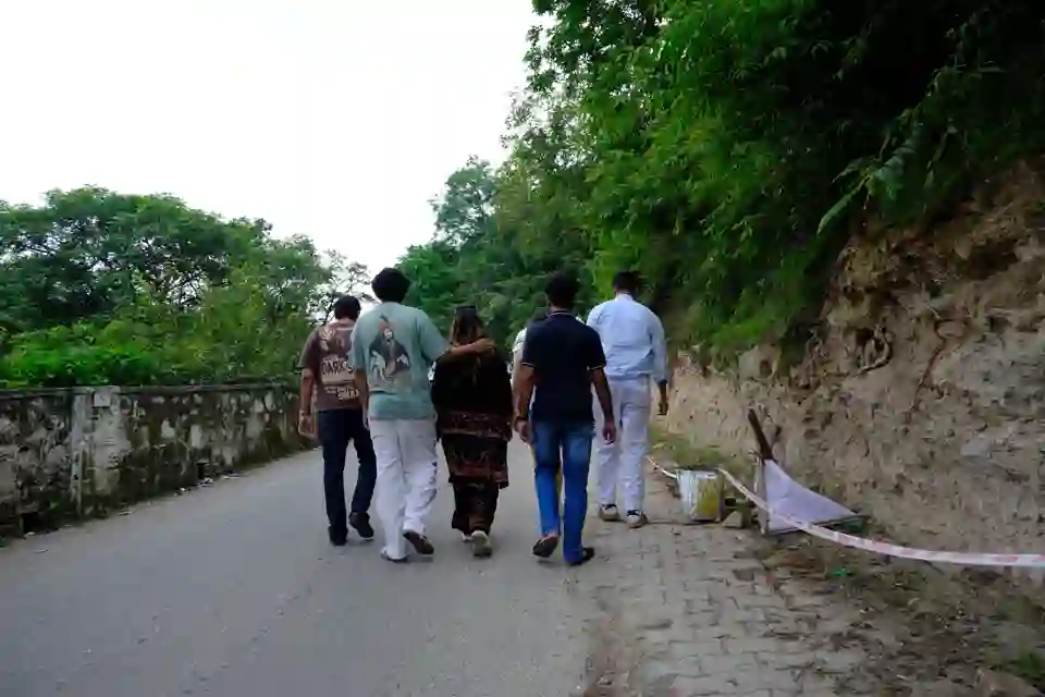 Travellers walking together along a forest road